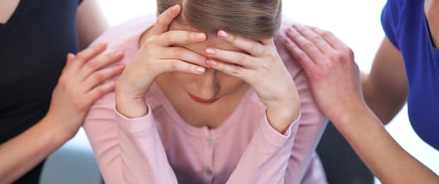 woman in Alcoholics Anonymous meeting