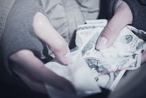 Fentanyl and money in hand