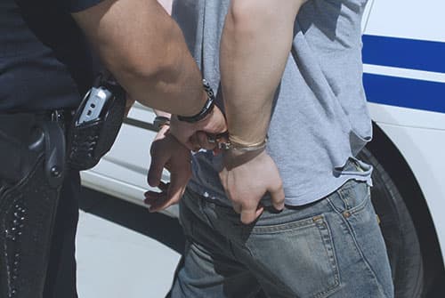 man getting arrested for drug related crimes