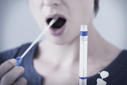 person using actiq mouth swab