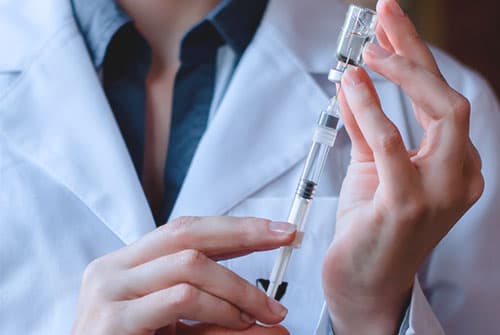 doctor preparing to administer vivitrol