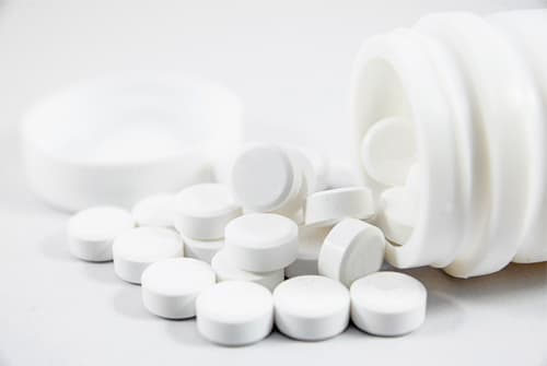 pills spilling out of bottle