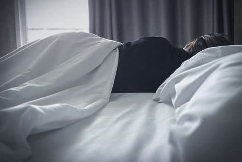woman lying in bed sleeping
