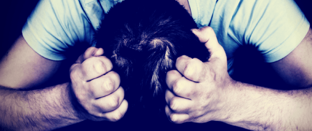 man head in hands