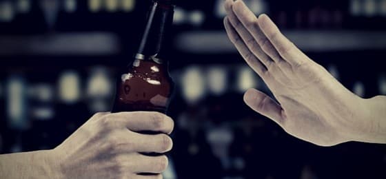 hand saying no to alcohol