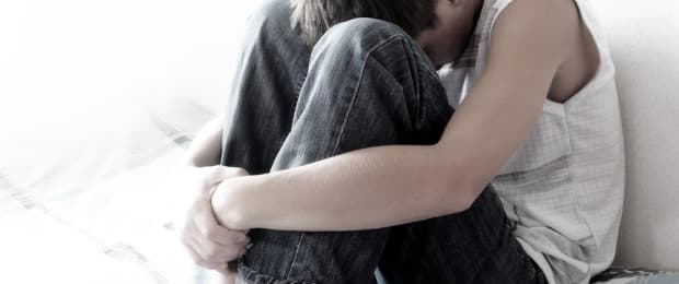 man with head down Tramadol addiction