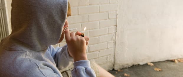 teenage boy smoking joint